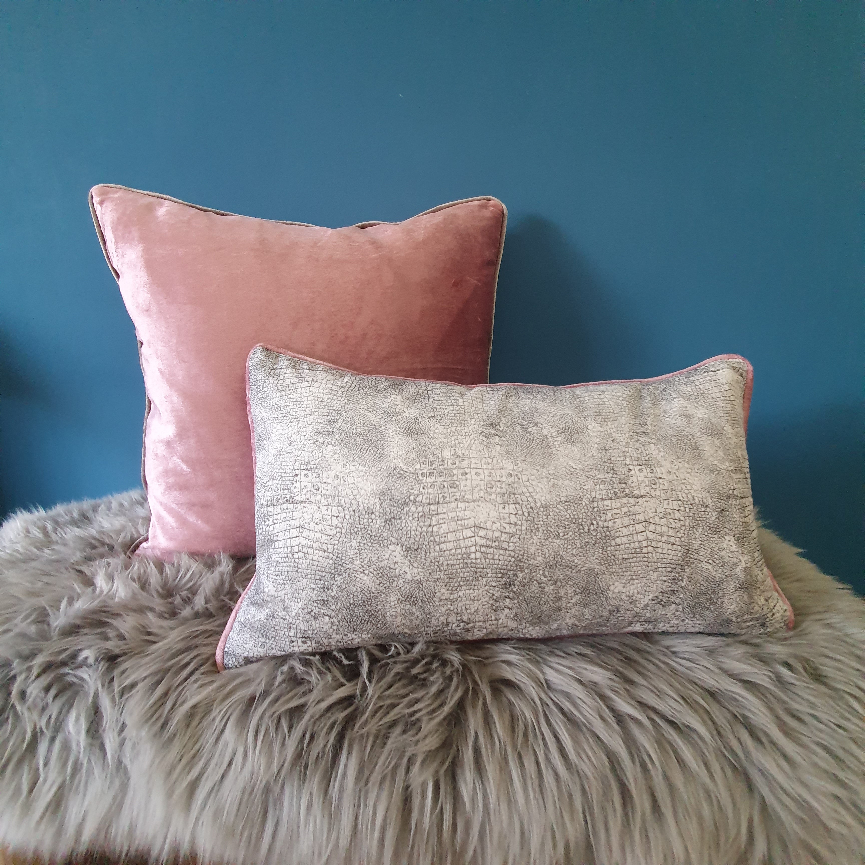 Abstract animal print velvet cushion with rose velvet piping