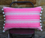 Load image into Gallery viewer, Chi Chi  Rectangular Neon Pink Cushion with Pom Poms.
