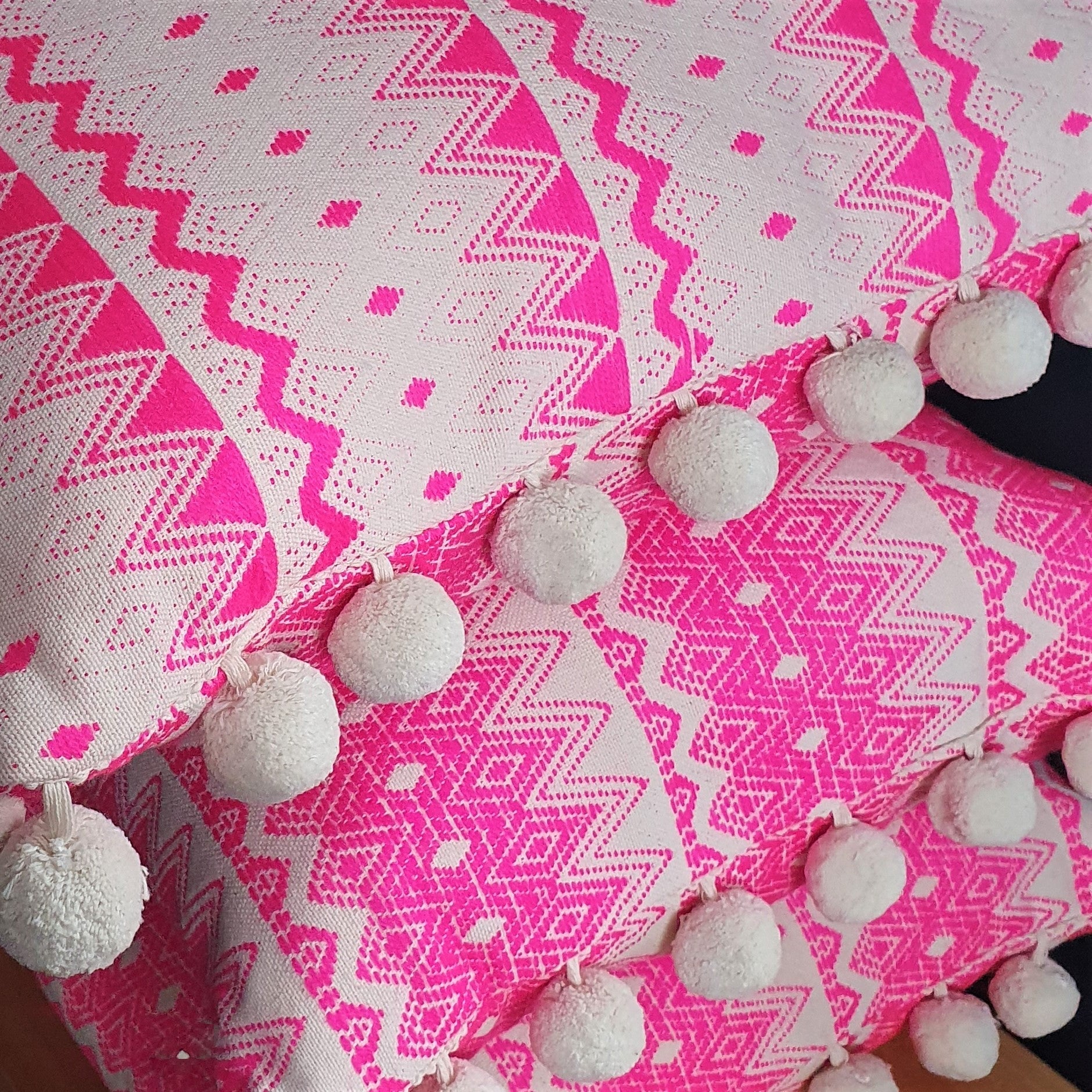 Chi Chi  Rectangular Neon Pink Cushion with Pom Poms.