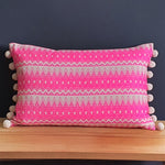 Load image into Gallery viewer, Chi Chi  Rectangular Neon Pink Cushion with Pom Poms.
