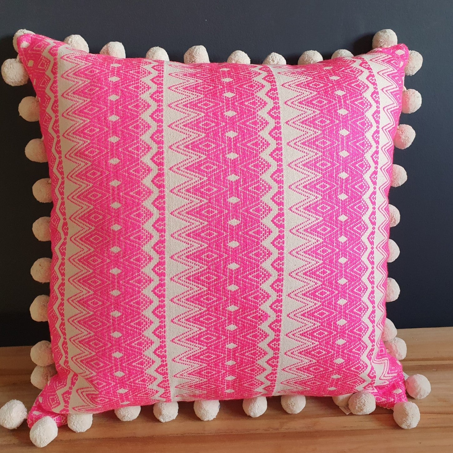 Chi Chi Large Square Double-Sided Neon Pink Cushion with Pom Poms.