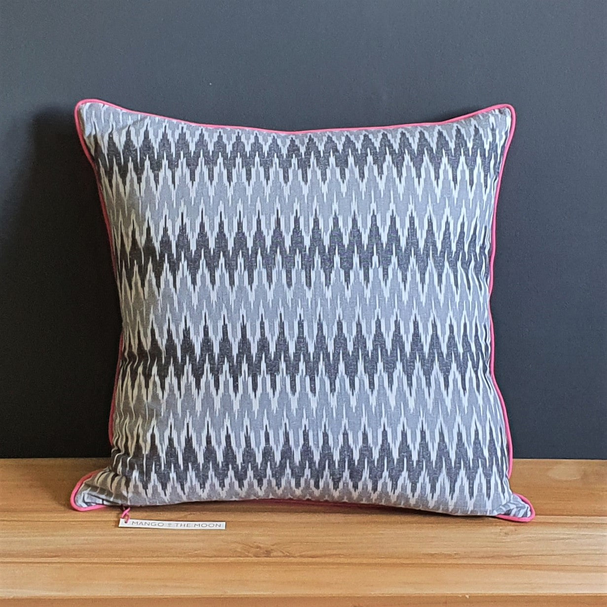 Damn The Weather! Large Square Ikat Cushion with Rose Pink Piping.
