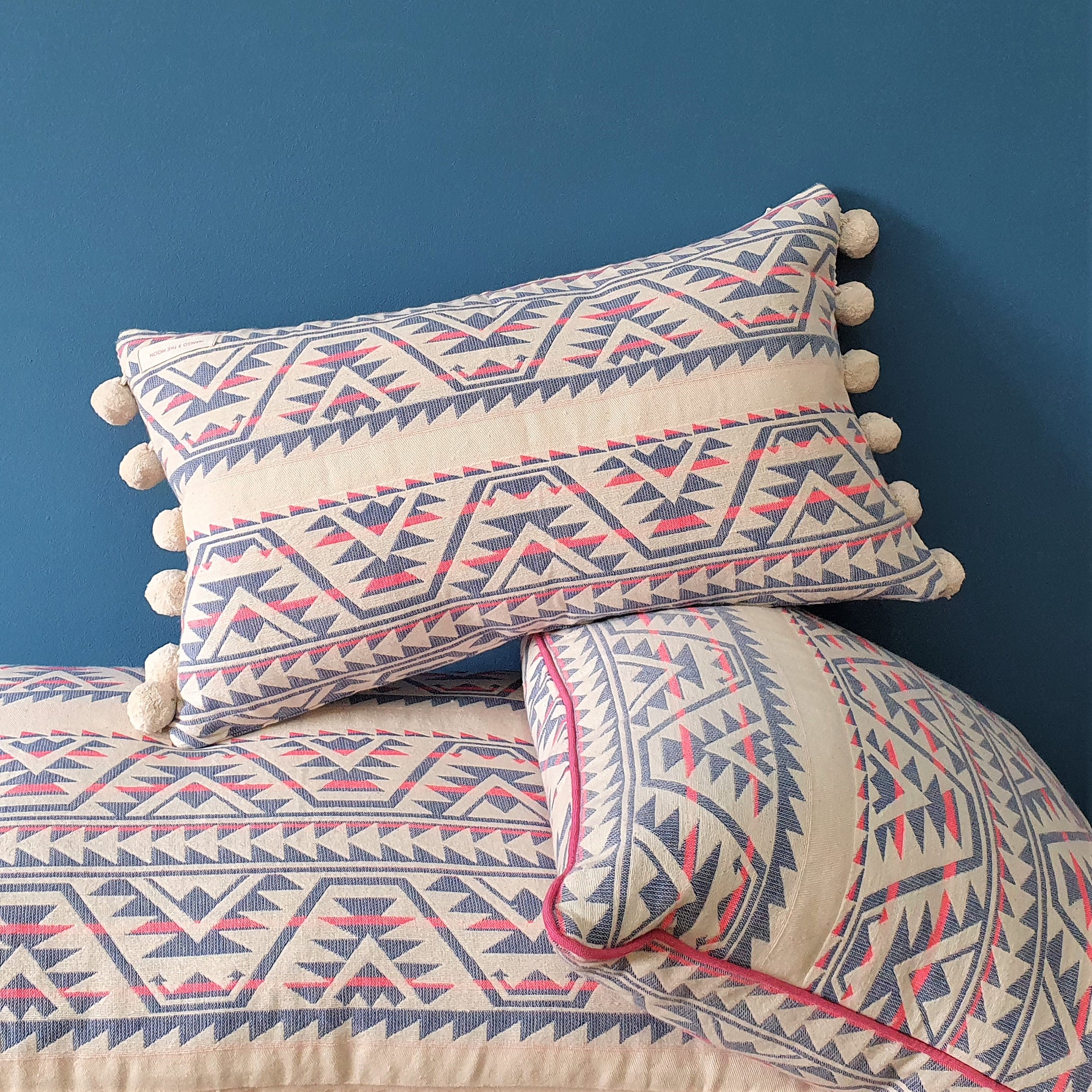 Neon Navajo Rectangular Cushion with Pom Poms.