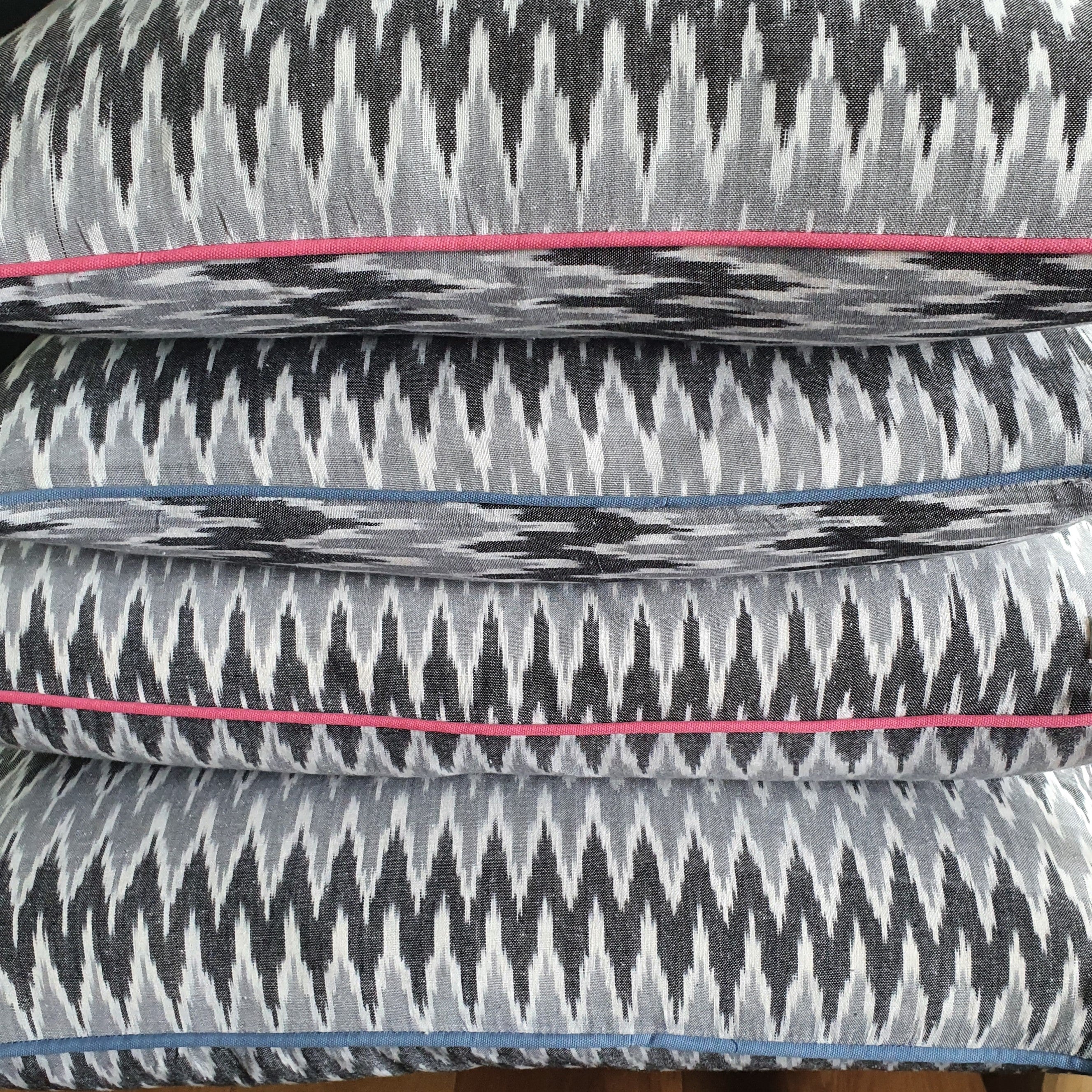 Damn The Weather! Large Rectangular Ikat Cushion with a Stormy Blue Piping.